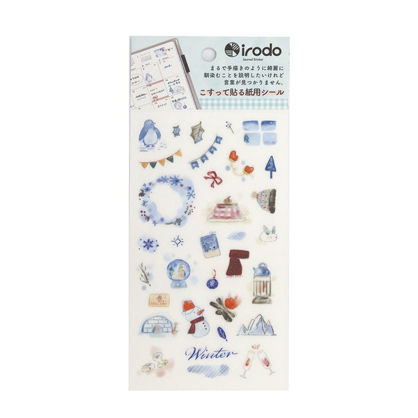 Sheet of decorative "paper-transfer" stickers with winter-themed designs on a white background, featuring the brand 'irodo'